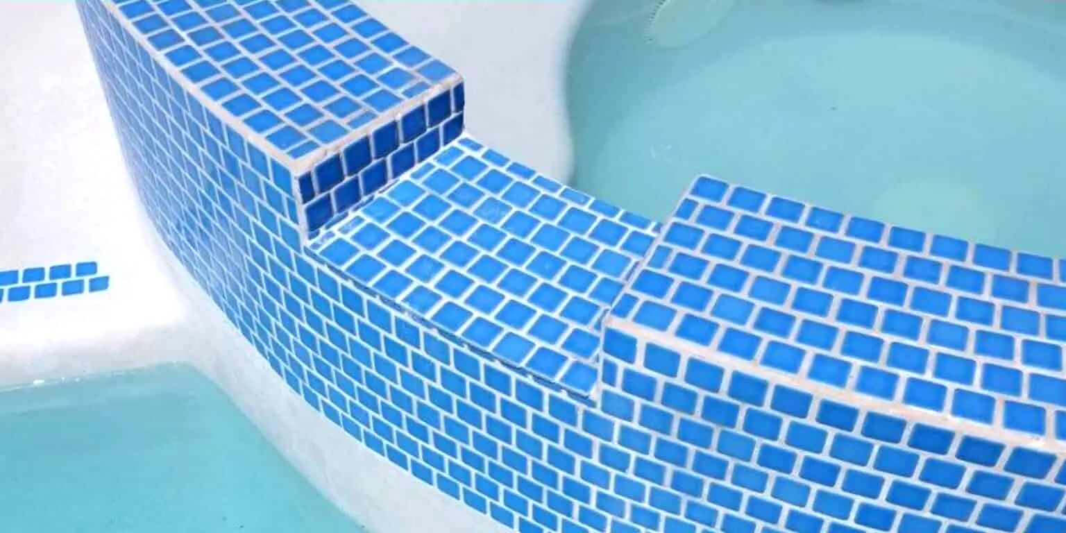Pool steps with calcium and mineral buildup before restoration, and clean bright tile after, After